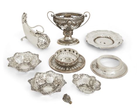 An Edwardian silver sugar caster. Henry Matthews, Birmingham, 1901. The body of octagonal cornucopia form with zoomorphic ter