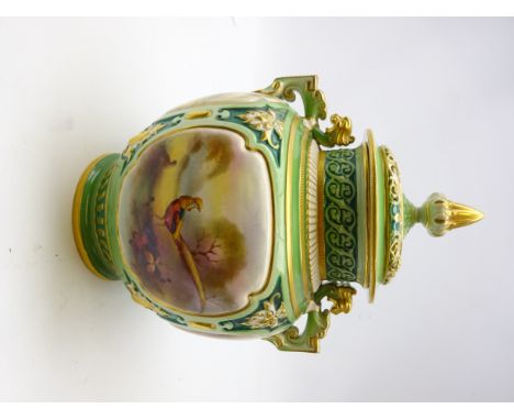 Early 20th century James Hadley Royal Worcester pot pourri vase and cover, with four hand painted panels, two decorated with 