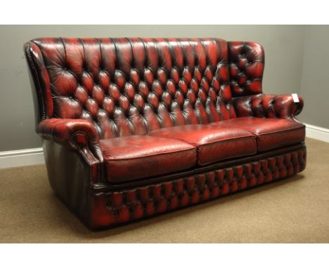 Georgian style three seat wing back sofa upholstered in oxblood buttoned leather, W185cm, D85cm   Condition Report   Click he