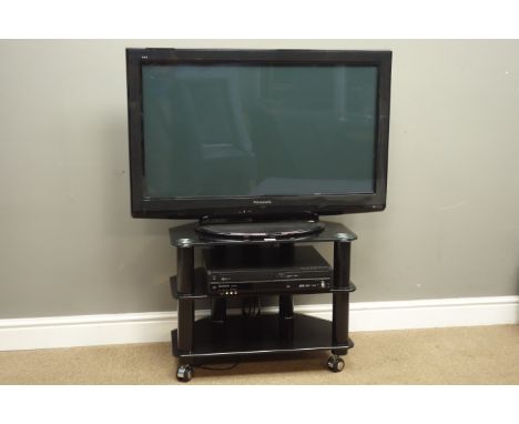 Panasonic TX-P37X20B 37" TV with DMR-EZ49VEB DVD recorder on three tier black glass stand. with remote controls and instructi