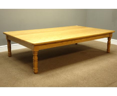 Large light oak coffee table on turned supports, 183cm x 107cm, H45cm   Condition Report   Click here for further images, con