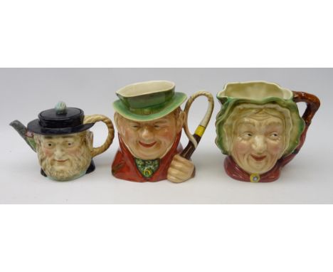 Two Beswick Dickens character jugs; 'Sairey Gamp' & 'Tony Weller' and 'Peggotty' teapot (3)   Condition Report   Click here f