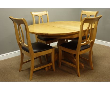 Solid light oak circular pedestal extending dining table L146cm, H76cm, W110cm, & a set of four chairs with black leather sea