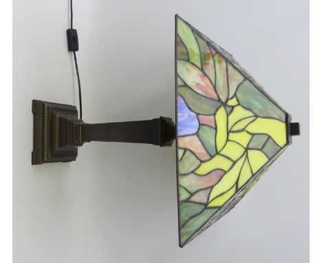 Tiffany style table lamp, with leaded and slag glass shade on a bronzed cast metal base, H62cm    Condition Report   Click he