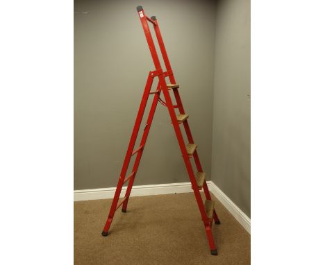 Wooden and red painted metal step ladders 