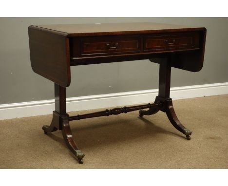 Regency style inlaid mahogany sofa table, two fall leaves and two frieze drawers on sabre legs with brass castors, W153cm, H7