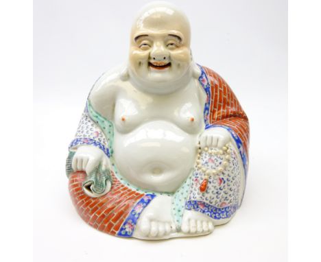 20th century porcelain figure of Hotei, seated wearing flowing robes, holding beads in his right hand with pierced decoration