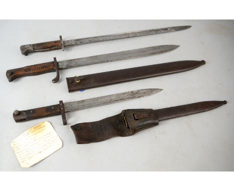 Three WWI bayonets German Butcher Erfurt steel blade, Austrian with metal scabbard and frog, British S.L.M.E.  .   