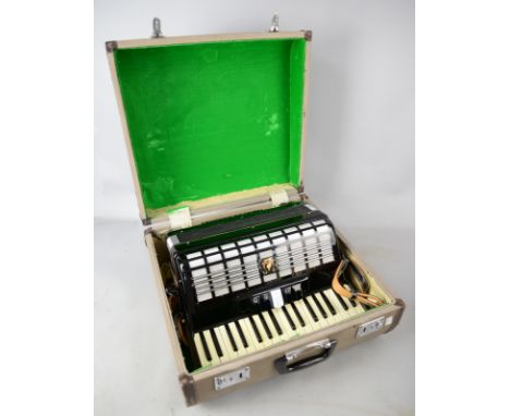 A Parrot accordion in fitted case.   