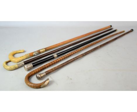 Silver mounted ebonized walking cane, silver mounted malacca walking stick, silver mounted malacca cane, horn handled cane, a