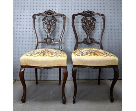 19th century mahogany dining chairs with tapestry seats .   