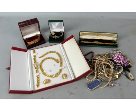 A collection of costume jewellery, faux pearls, butterfly necklace, bangles, bracelets, crystal heart pendant, Celtic style b