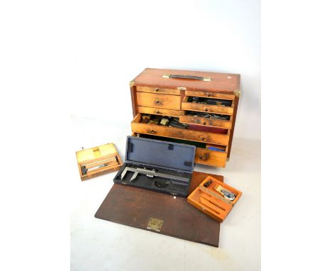 Emir fall front tool chest enclosing drawers and containing various engineering tools.   