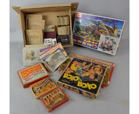 Collection of cigarette cards, vintage games and Shinsha Thunderbirds, International Rescue.   