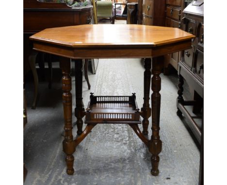 Walnut lamp table and an oak nest of tables .   