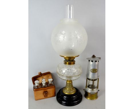 Brass and glass oil lamp, minors lamp and bottle set in leather case .   