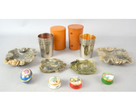 Two Halcyon Days Christmas boxes, two other enamel boxes and two sets of hunting cups, and two pairs of soapstone ashtrays.. 