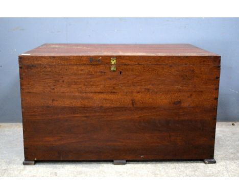 An early 20th century mahogany trunk.   