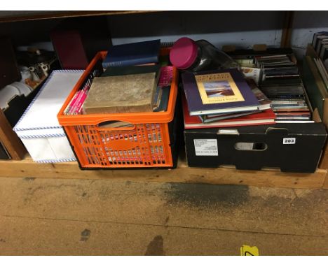 A shelf of assorted to include CDs and Ordnance Survey maps etc.