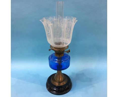 An oil lamp with blue glaze reservoir