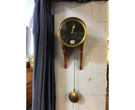 A 'Moscrops Patent' fusee clock movement, 22cm diameter, mounted on a mahogany bracket 