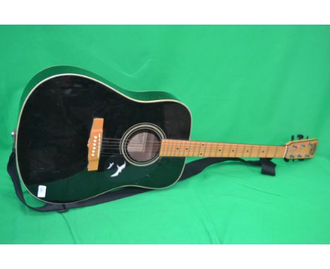 A Tanglewood six string accoustic guitar having an ebonised finish