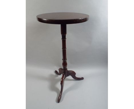 A George III Mahogany Kettle Stand with a Solid Top over Turned Stem and Tripod Base. 66cm Diameter