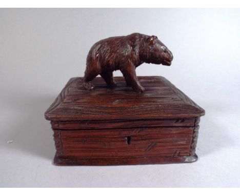 A 19th Century Black Forest Carved Linden Wood Trinket Box, The Top Decorated with a Carved Bear. 16x16x12cm