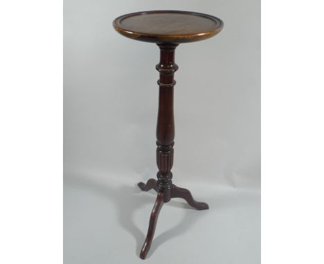 A Turned Mahogany Tripod Torchere Stand. 