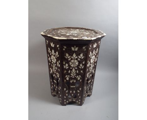 An Islamic Mother of Pearl Inlaid Octagonal Stand. 50cm High.