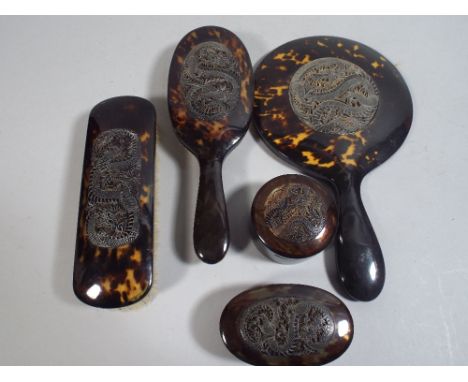 An Art Deco Japanese Tortoiseshell Five Piece Dressing Table Set Carved and Pierced with Dragon Decoration. 