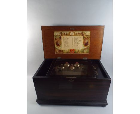 A Late 19th Century Continental 24 Air Music Box with Five Bells Having Enamelled Flower Finials and Bee and Butterfly Hammer