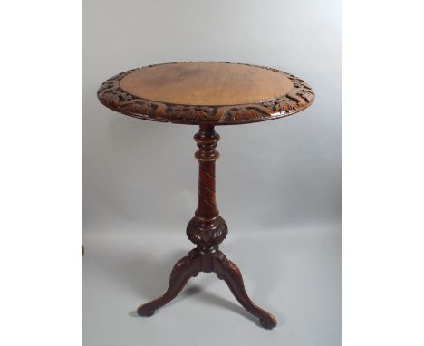 A Victorian Walnut Tripod Wine Table with Carved Circular Border to Top and Turned Suppport. 43cm Diamter, 70cm High