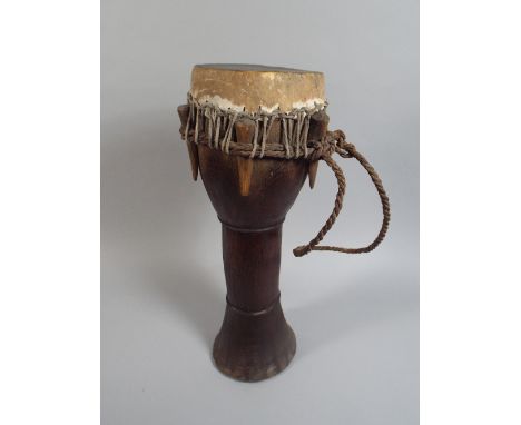 An African Tribal Art Drum with Animal Skin Top over a Carved Wasted Body. 44cm High