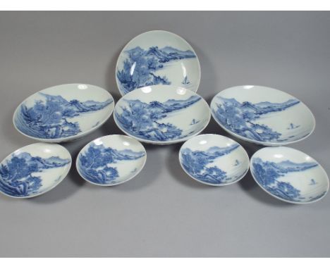 A Set of Four Large and Four Small Shallow Footed Porcelain Bowls Depicting Oriental Scene in Blue Enamel. Mark to Base.