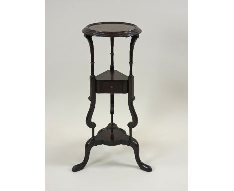 A George III style mahogany washbowl stand, the circular shelf top over a central single drawer with jug shelf to the base, o