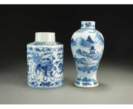 A Chinese blue and white tea caddy, 19th Century, of cylindrical form and decorated with guardian lions chasing a ball, 14.5c