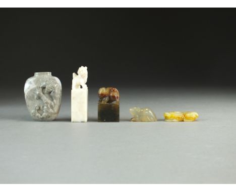 A group of Chinese hardstones, 19th/20th Century, including a green and russet jade pendant of a chilong holding a coin, 4cm,