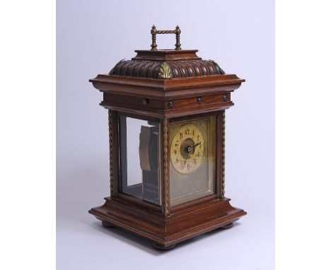 A late 19th / early 20th century German musical carriage style walnut cased alarm clock by Junghans, playing on a 4.5 inch di