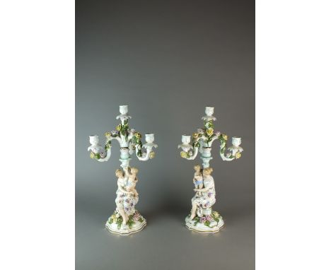 A pair of Dresden porcelain figural candelabra, late 19th century, 53cm high (2)