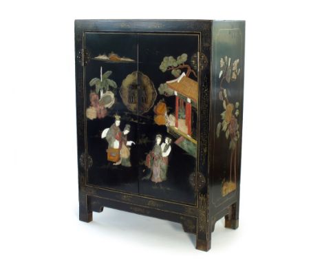 A Chinese inlaid lacquer cabinet, late Qing Dynasty, of rectangular outline with twin doors opening to a single shelf interio