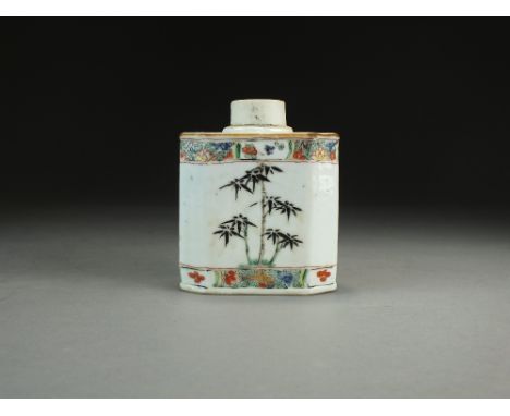 A Chinese famille verte tea caddy, 18th Century, of canted rectangular form, decorated wth bamboo plants between panel border
