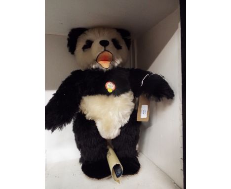 A boxed Steiff reproduced 1951 growler 'Panda' bear limited edition no 01288/3000 complete with tag and certificate 