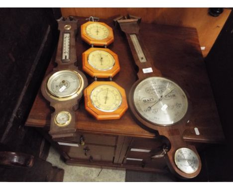 Two barometer thermometers and another 
