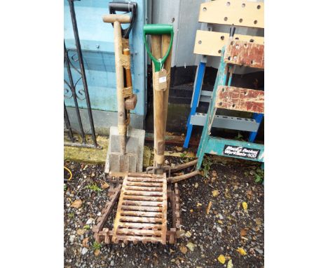 Two pick axes, two garden forks, a garden spade, shovel and a club hammer together with a cast iron fire basket
