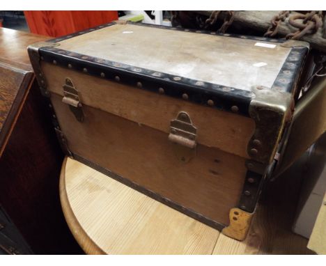 A small vintage wooden and metal bound trunk with painted name reading 'A.W.J. Bell'