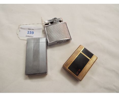 A gold plated Dupont black lacquered cigarette lighter with Chinese character marks no.BJ9986, together with a Colibri electr