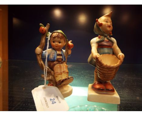 A Goebel figure of a girl with basket and another of a boy in an apple tree