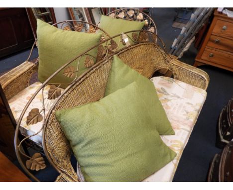 A gilt metal and wicker conservatory suite comprising of settee, two armchairs, coffee table and five shelf bookcase 