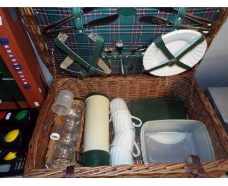 An Optima wicker picnic hamper complete with fitted interior and contents